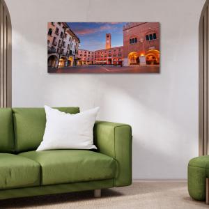 Lupia - Quadro moderno su Tela Canvas DEEP 65X143 cm, con paesaggi e localismi italiani, per casa, soggiorno, capezzale camera da letto, hotel, ufficio, TREVISO - PIAZZA DEI SIGNORI SERA      del brand Lupia, categoria: Arredo e decorazioni > Quadri e Tele > Quadri cittÃ  e Localismi.