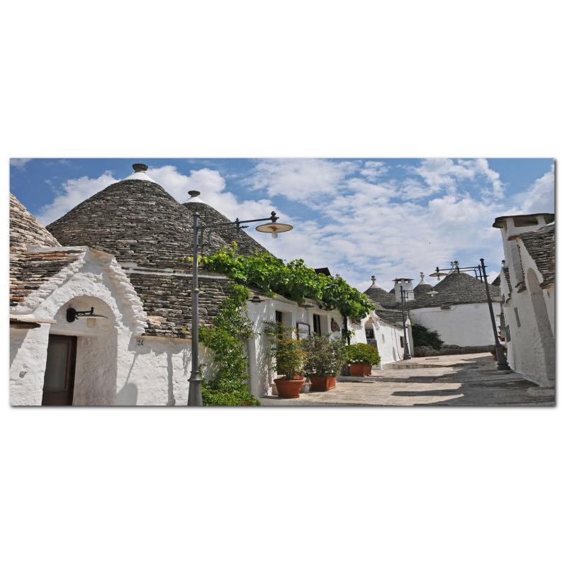 Lupia - Quadro moderno su Tela Canvas DEEP 65X143 cm, con paesaggi e localismi italiani, per casa, soggiorno, capezzale camera da letto, hotel, ufficio, PUGLIA - STRADINA TRULLI               del brand Lupia, categoria: Arredo e decorazioni > Quadri e Tele > Quadri cittÃ  e Localismi, disponibile su Vorreishop.